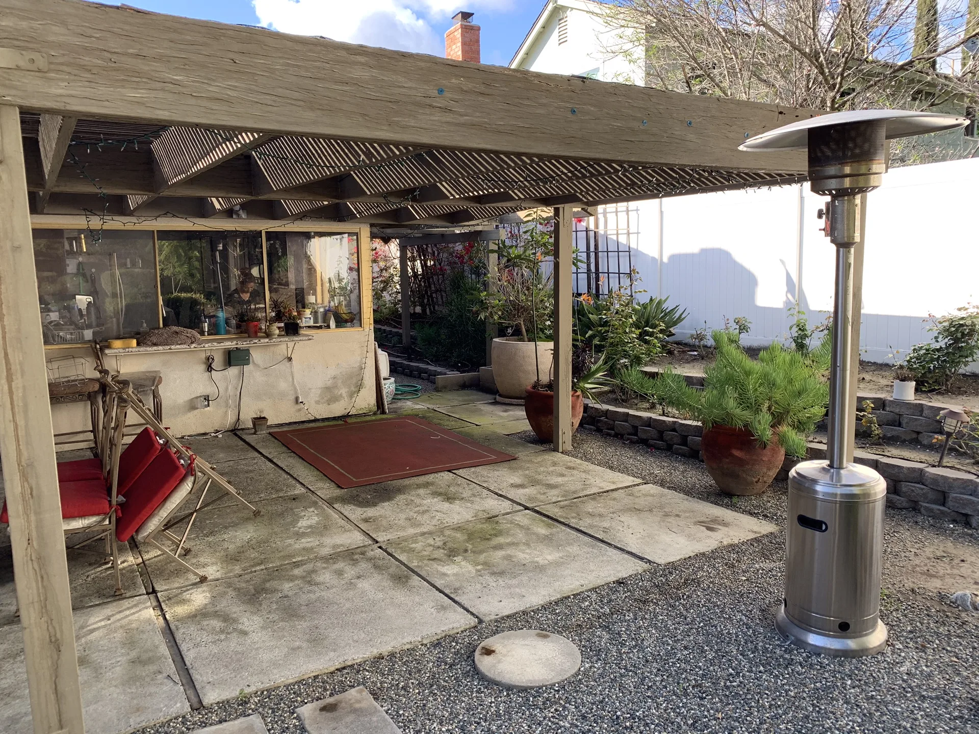 The original patio cover and hardscape before demolition began.